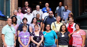 Educators attending a professional development program pose for a photo outside The Sixth Floor Museum.