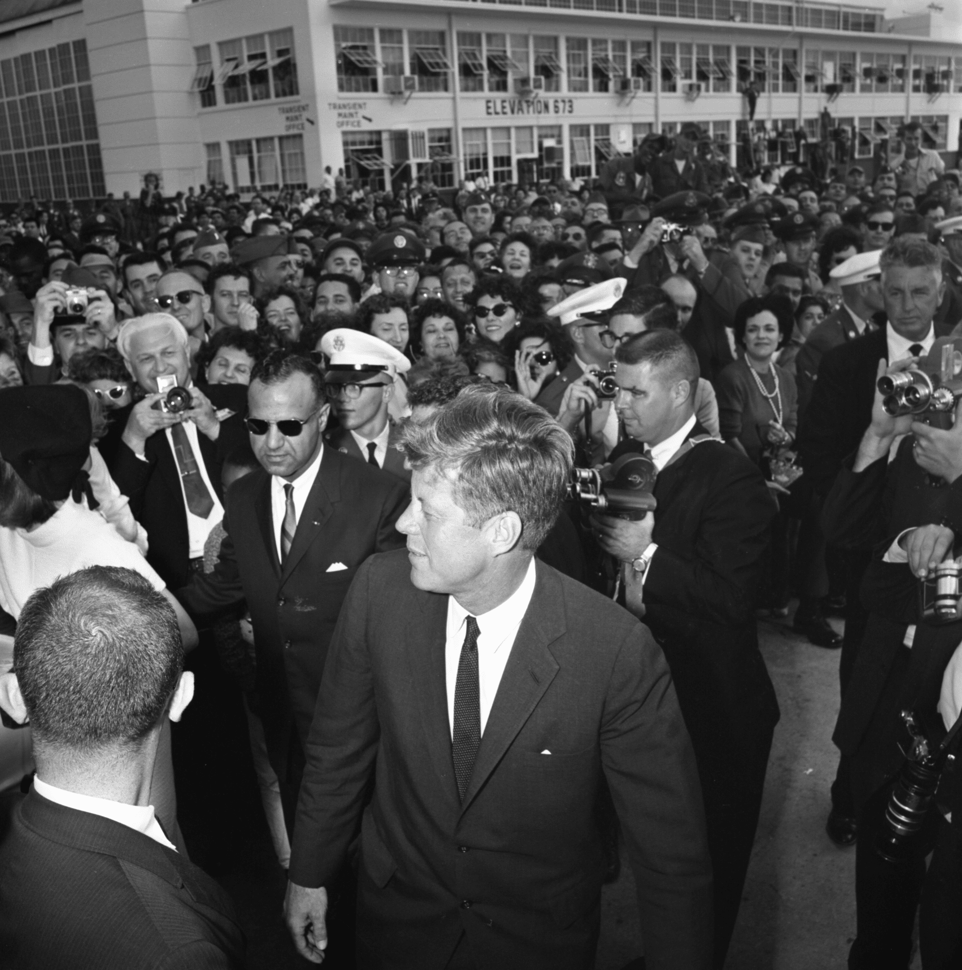 President and Mrs. Kennedy are surrounded by enthusiastic well-wishers before their departure from San Antonio at Kelly Air Force Base.
Dallas Morning News Collection / The Sixth Floor Museum at Dealey Plaza. Donated in the interest of preserving history.